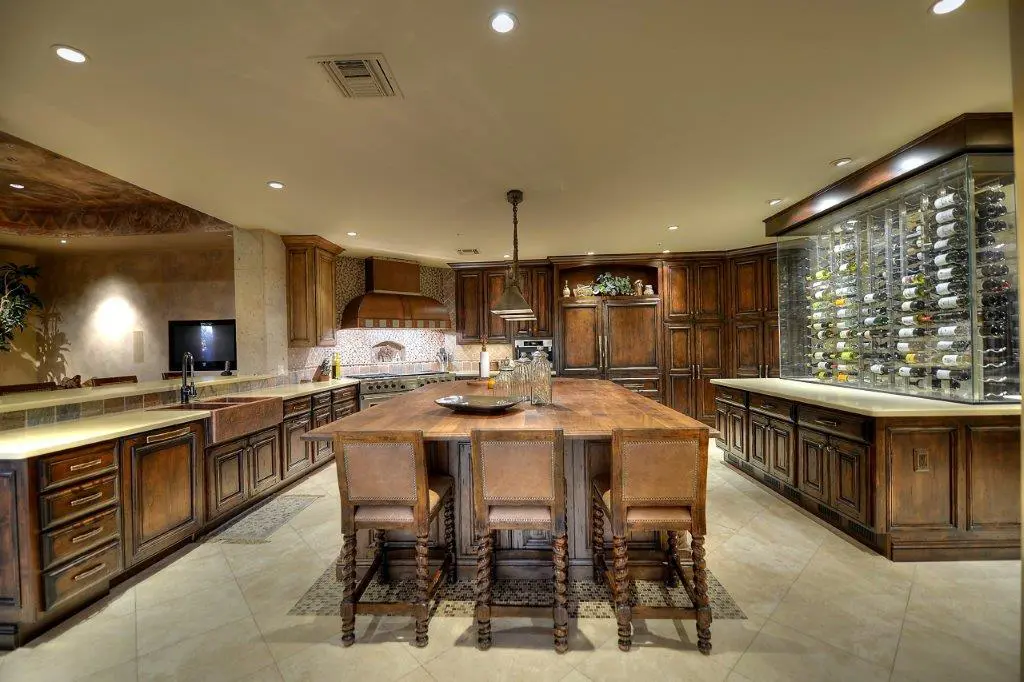 A large kitchen with wooden cabinets and island